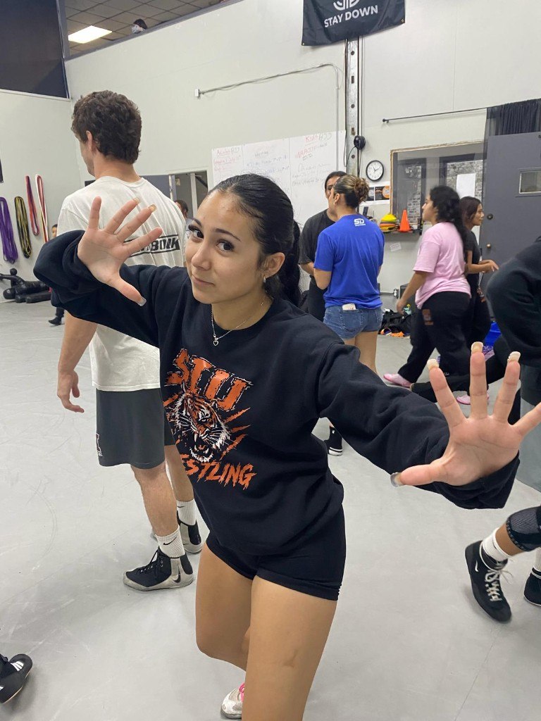 SIU Wrestling athlete in team sweatshirt